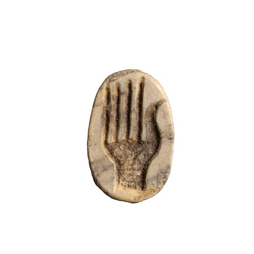 A New-Kingdom steatite glazed scarab. Hand.
